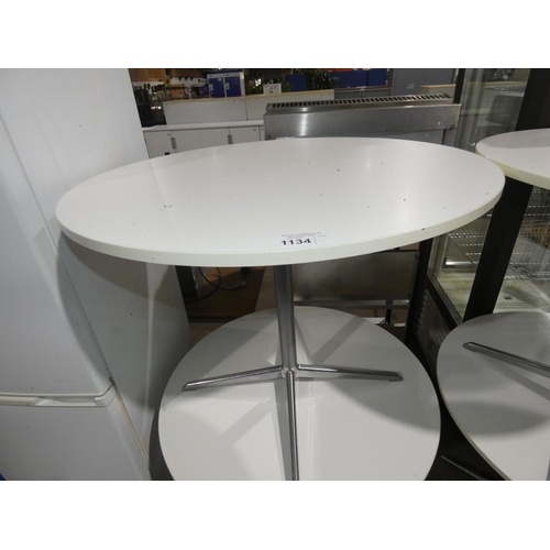 1134 - A white round cafe type table with metal pedestal base approx 90cm