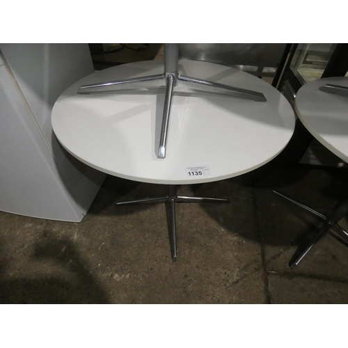 1135 - A white round cafe type table with metal pedestal base approx 90cm