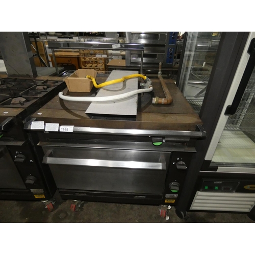 1148 - A gas fired solid top range with oven below (fold down door) by Falcon type Chieftain - trade