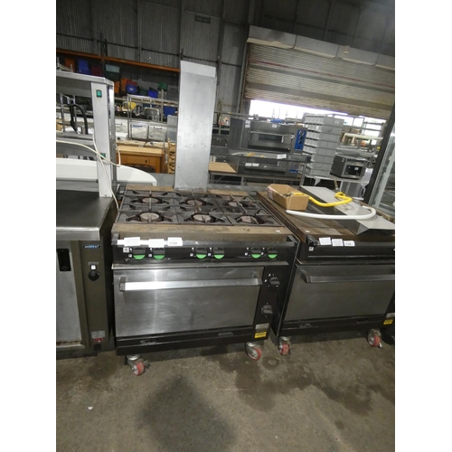 1149 - A gas fired 6 burner range with oven below (fold down door) by Falcon type Chieftain - trade