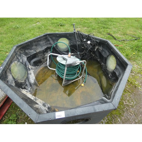 2582 - A Blagdon octagonal rattan style garden water feature/fish pond with hose, filter/pump/fountain with... 