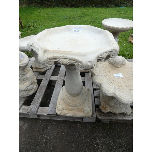 2602 - A Gothic style concrete bird bath with a hexagonal top