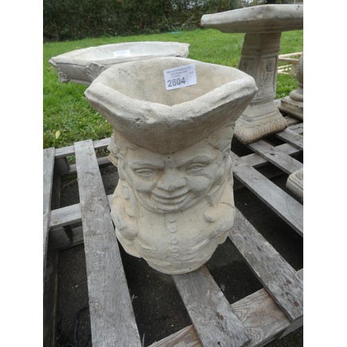 2604 - A large Toby jug style concrete planter