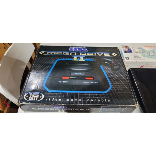 2435 - A Sega Mega Drive II console boxed with 2 controllers, a Nintendo DS lite handheld console boxed wit... 