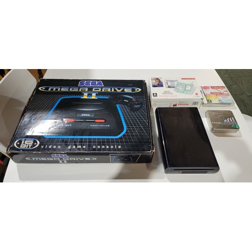 2435 - A Sega Mega Drive II console boxed with 2 controllers, a Nintendo DS lite handheld console boxed wit... 