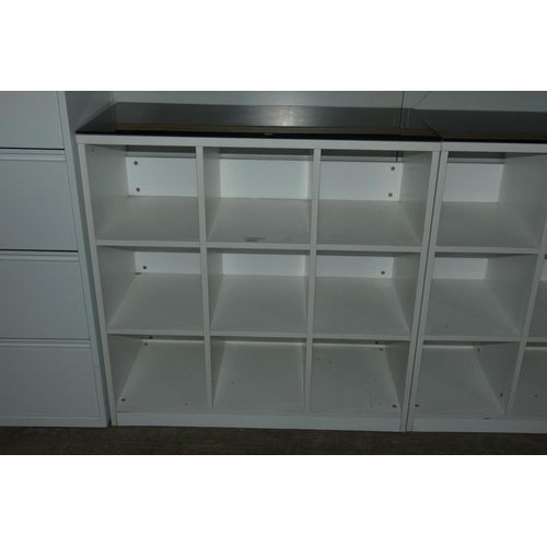 1191 - A white 9 shelf open front storage cabinet with black glass top approx 100 x 45 x 101cm high