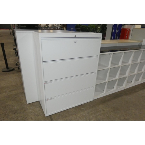 1192 - A white metal four drawer lateral filing cabinet approx 100 x 47 x 133cm high