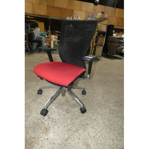 1239 - 1 office swivel chair by Techo with red seat and a black mesh back