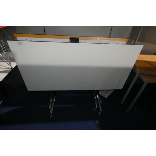 1257 - 1 office table on wheels with a light grey tipping top approx 150 x 75cm