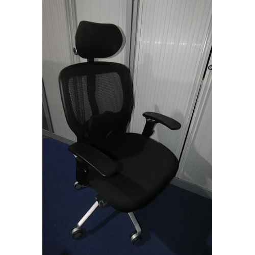 1262 - 1 office swivel chair with black upholstered seat / head rest and a black mesh back type SR1 but no ... 