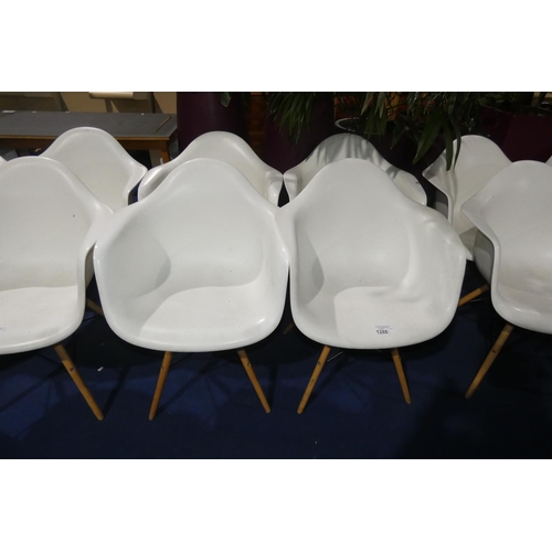 1288 - 4 x white plastic designer style chairs with wood / black metal legs