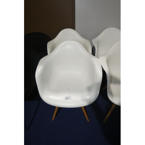 1291 - 2 x white plastic designer style chairs with wood / black metal legs