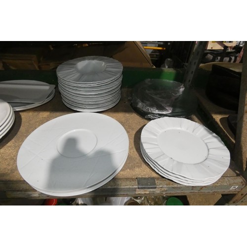 1032 - A quantity of various catering related items including plates, bowls, serving platters etc. Contents... 