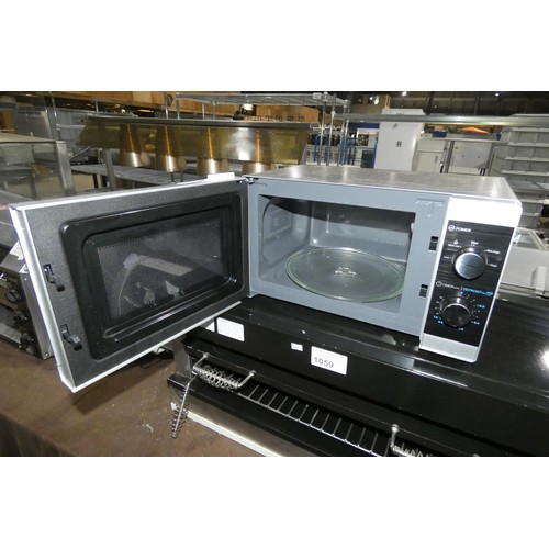 1058 - A microwave oven by Sharp - trade. TESTED WORKING