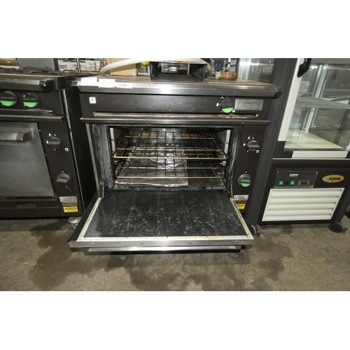 1148 - A gas fired solid top range with oven below (fold down door) by Falcon type Chieftain - trade