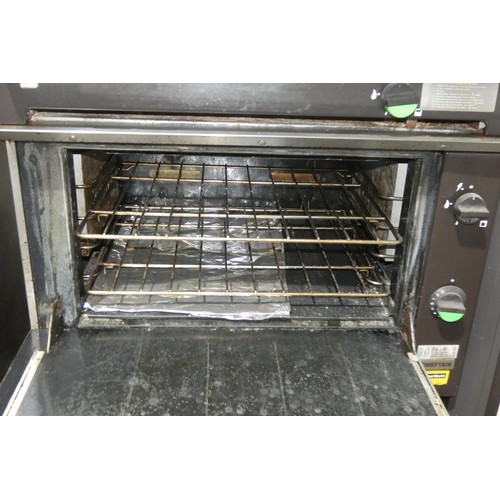 1148 - A gas fired solid top range with oven below (fold down door) by Falcon type Chieftain - trade