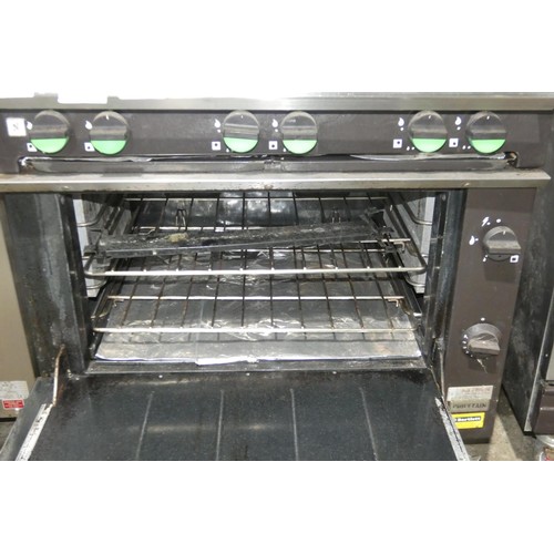 1149 - A gas fired 6 burner range with oven below (fold down door) by Falcon type Chieftain - trade