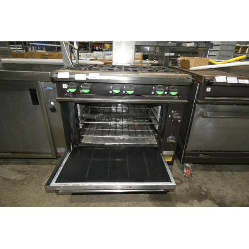 1149 - A gas fired 6 burner range with oven below (fold down door) by Falcon type Chieftain - trade