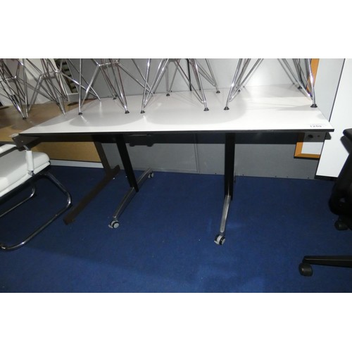 1259 - 1 office table on wheels with a light grey tipping top approx 150 x 75cm