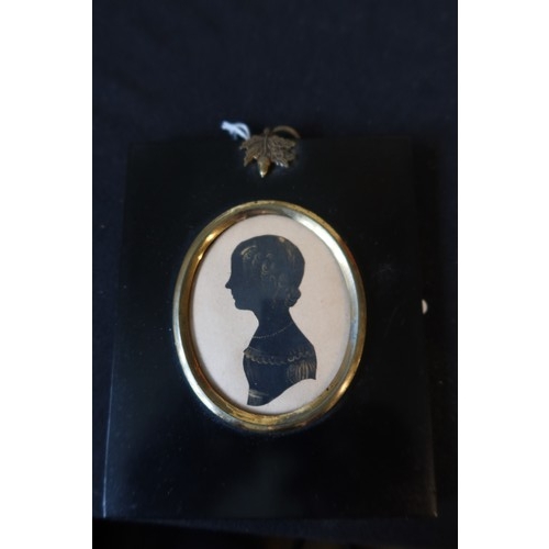 3014 - William Seville (British, fl.c.1818-1845), Silhouette portrait miniature of a young girl, cut and hi... 