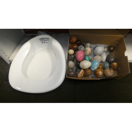 3095 - A vintage bedpan and a collection of polished stoneware eggs