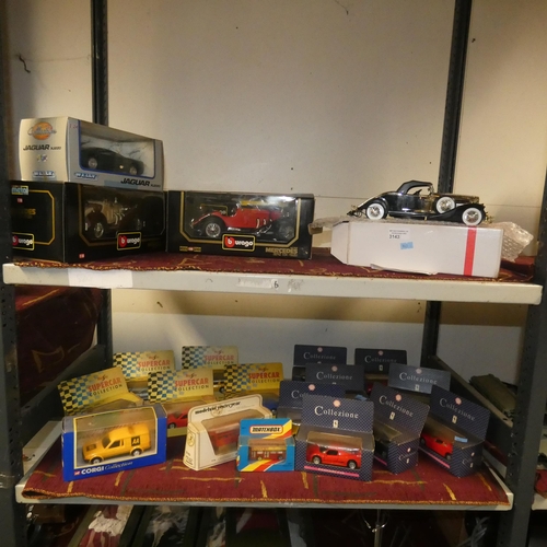 3143 - A quantity of various boxed diecast and other model vehicles (2 shelves)