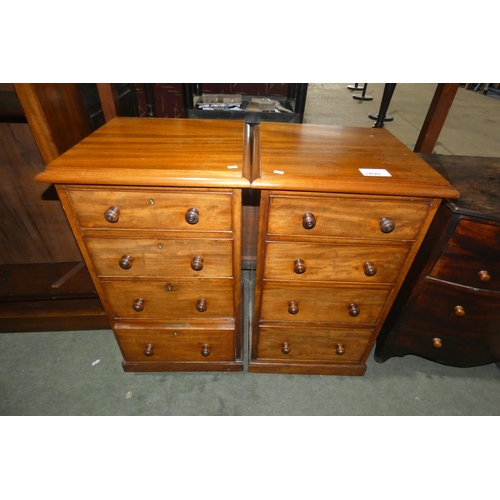 A pair of of Edwardian mahogany four drawer bedside drawers