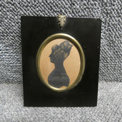 3022 - W. Seville (British 1818-1845), Silhouette of a lady, painted on card with gilded highlights, oval, ... 