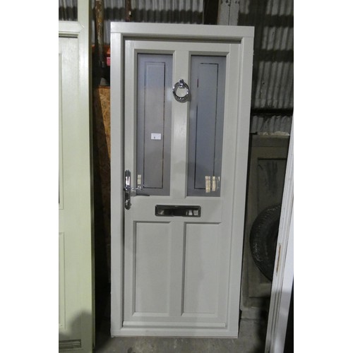 6 - An Evolution PVC external door in frame, colour is French grey outside / light green inside, 1 x key... 