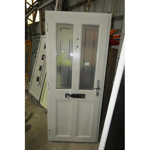 6 - An Evolution PVC external door in frame, colour is French grey outside / light green inside, 1 x key... 