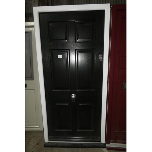 7 - An engineered hardwood external door in frame, colour is black door / white frame both sides, 3 x ke... 