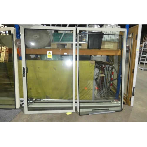 14 - A two pane sliding external door in aluminium frame, French grey both sides, no key is included, the... 