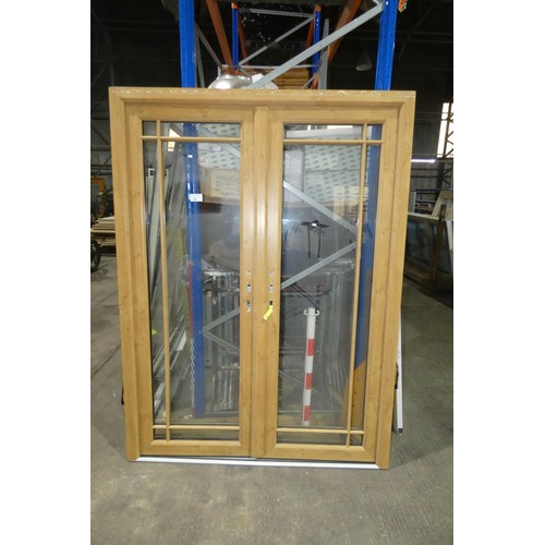 15 - A pair of PVC external French doors in frame, colour is Oak effect on both sides, no handles fitted ... 