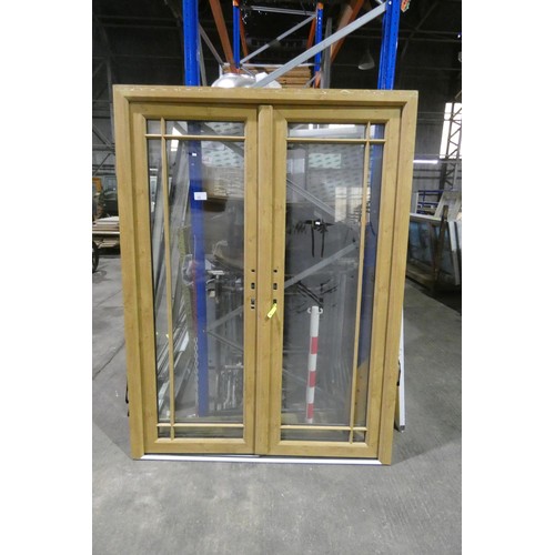 15 - A pair of PVC external French doors in frame, colour is Oak effect on both sides, no handles fitted ... 