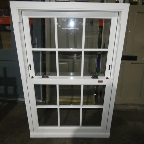 61 - A PVCu double glazed sash window, colour is white on both sides, overall size of frame is approx 100... 