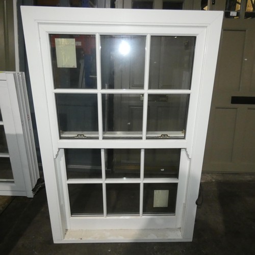 62 - A PVCu double glazed sash window, colour is white on both sides, overall size of frame is approx 100... 