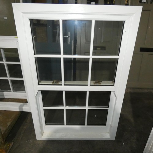 63 - A PVCu double glazed sash window, colour is white on both sides, overall size of frame is approx 100... 