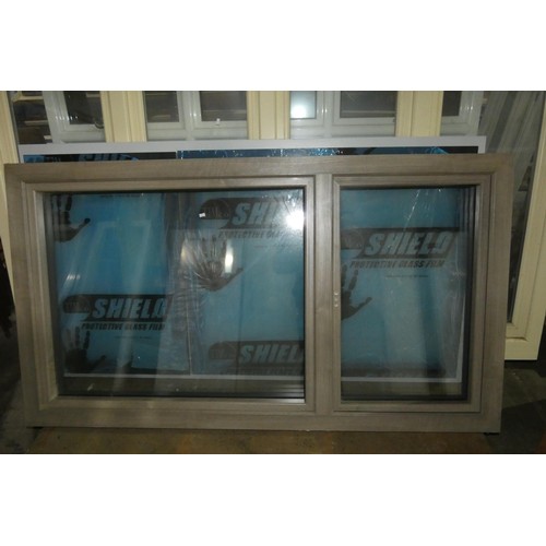 65 - An Apeer PVC high spec triple glazed window, colour is wood effect one side and white on the other s... 