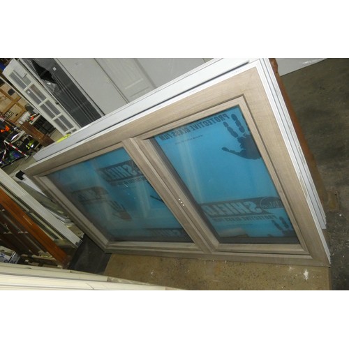 66 - An Apeer PVC high spec triple glazed window, colour is wood effect one side and white on the other s... 