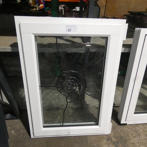 87 - A small PVC double glazed window with decorative glass, colour is white both sides, overall size of ... 