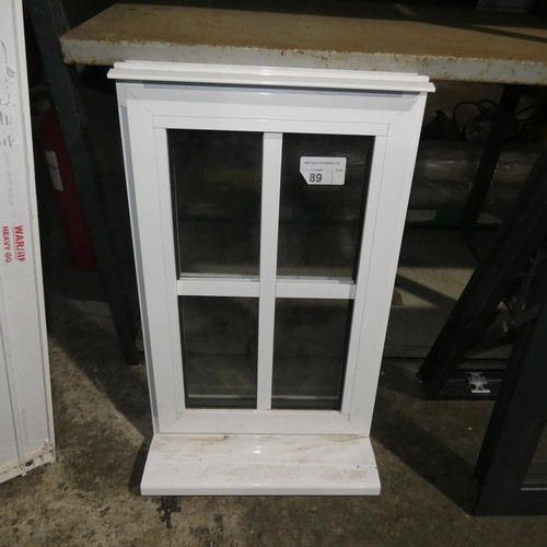 89 - A small aluminium double glazed top hinged window, colour is white both sides, overall size of frame... 