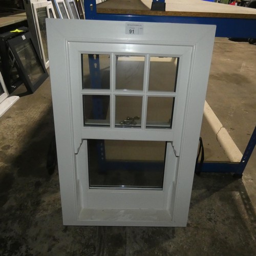 91 - A PVC double glazed sash window, colour is white on both sides, overall size of frame is approx 60cm... 