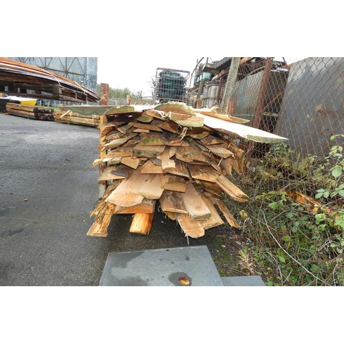 733 - 1 stillage containing a quantity of waney edge boards, measuring up to approx 380cm, please note the... 