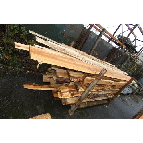 733 - 1 stillage containing a quantity of waney edge boards, measuring up to approx 380cm, please note the... 