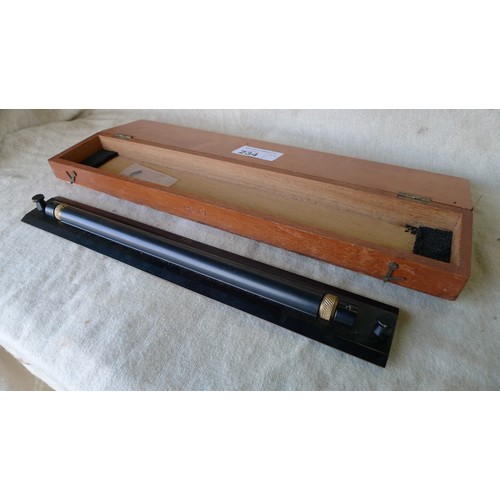 234 - A vintage precision 17.5 inch black painted metal T29 rolling ruler supplied in a wooden case