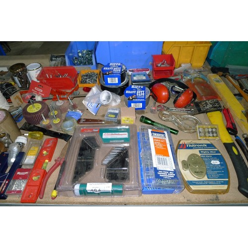 484 - A large quantity of various tools and other items including whet stones, rolls of tape, 2 axes, flap... 