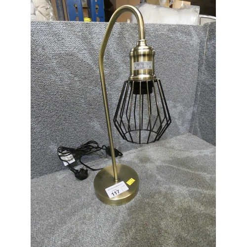 117 - A table lamp with a metal cage shade