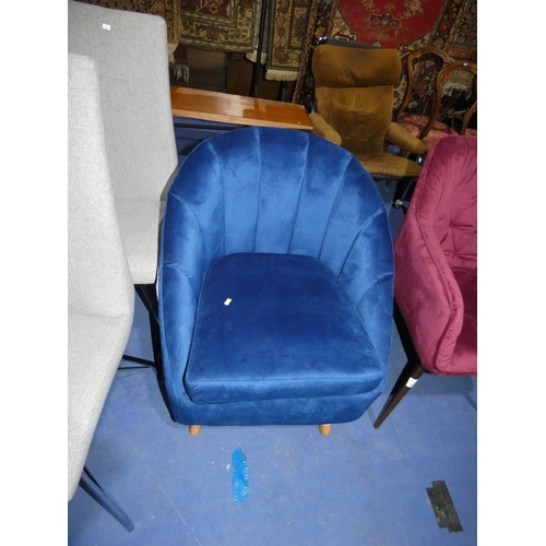 454 - A plush blue upholstered chair