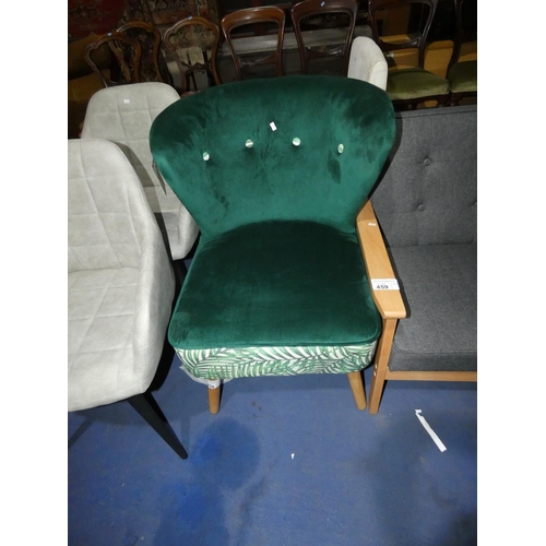 458 - A plush green / leaf patterned upholstered button back chair