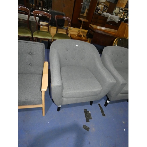 460 - A grey upholstered button back arm chair